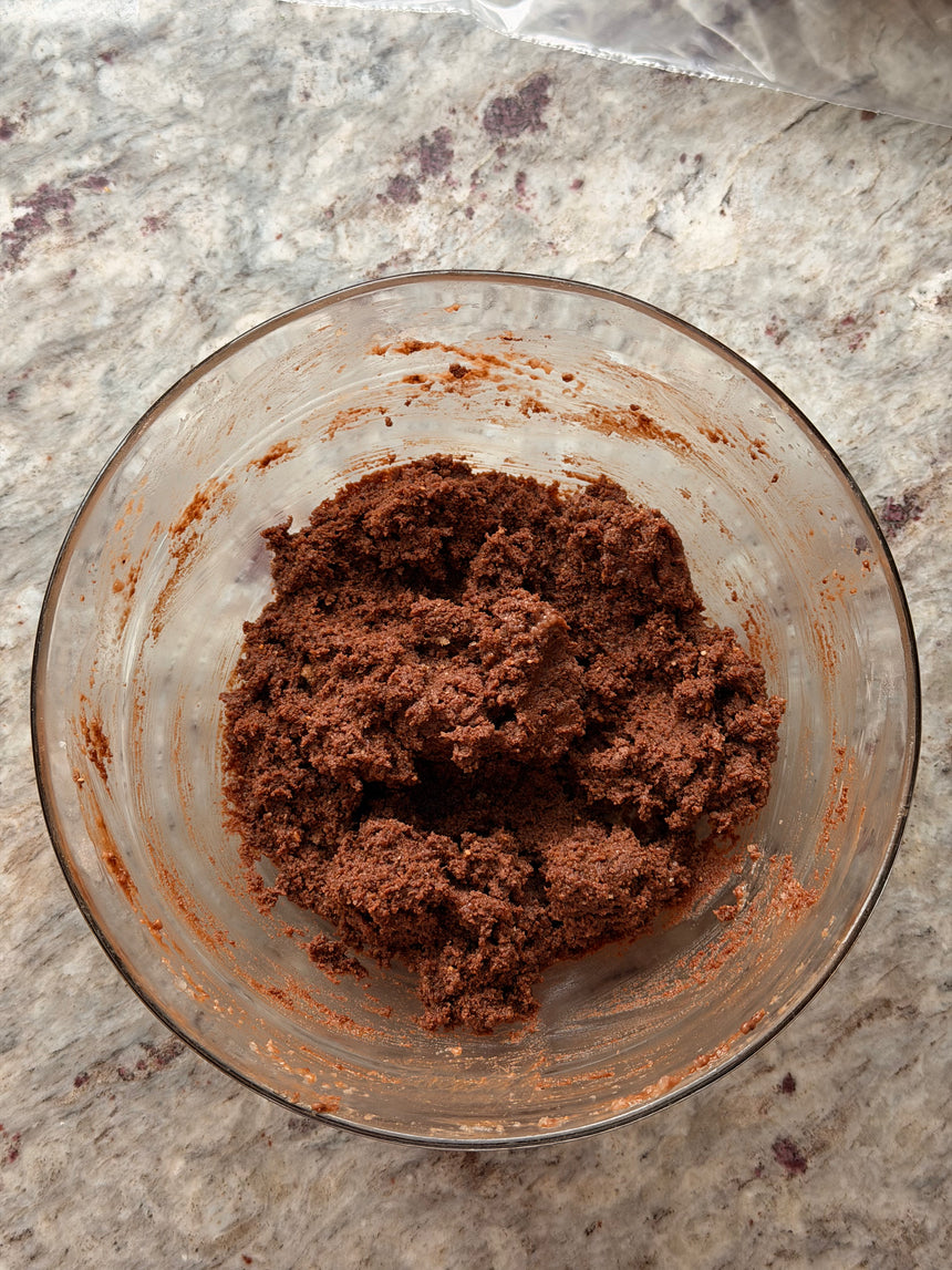 Glass bowl with chocolate dough on a marble countertop – photo 8