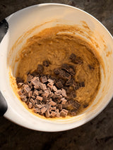 Bowl of cookie dough with chocolate chunks on a dark surface – thumbnail 9